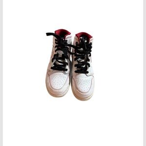 Nike Air Jordan 1 Mid Retro in the "White Gym Red" color.